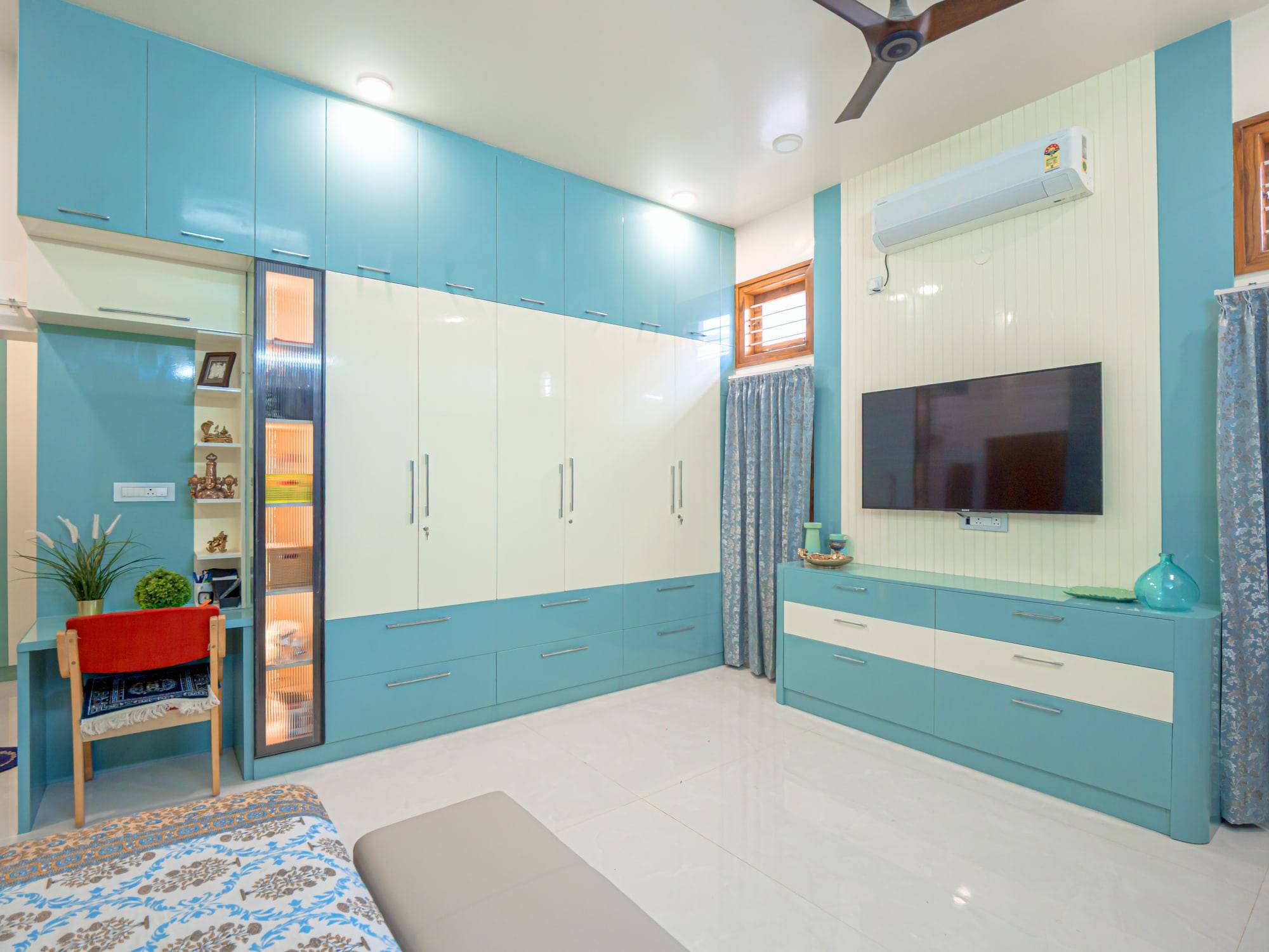Second bedroom with turquoise and ivory wardrobe and study desk
