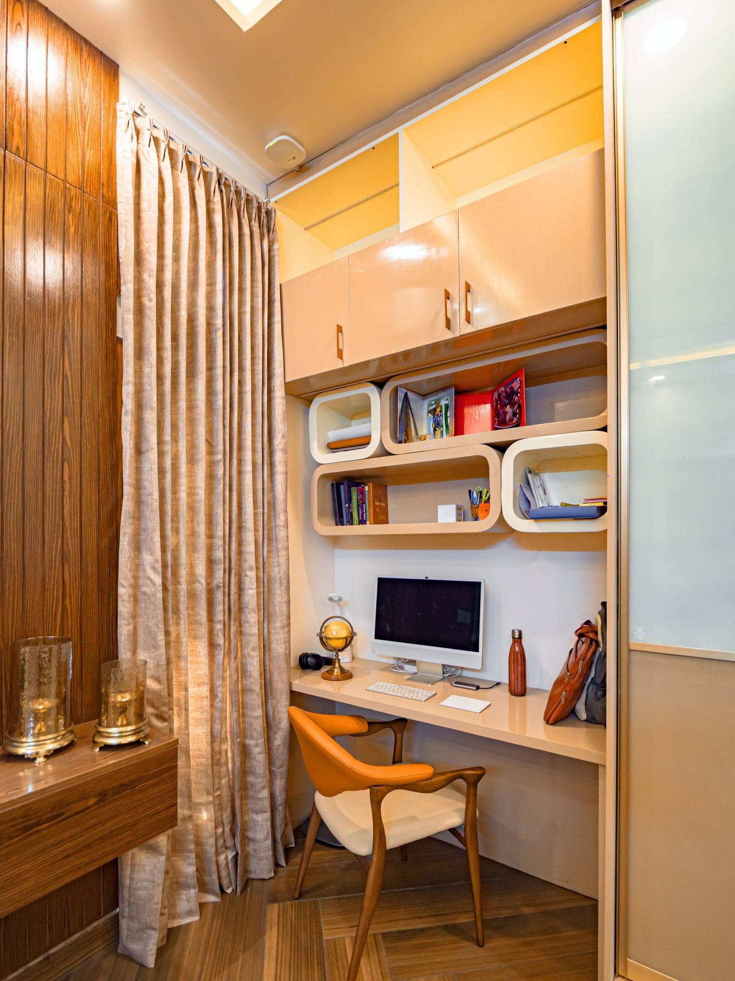 Master bedroom integrated study nook with floating curved shelving