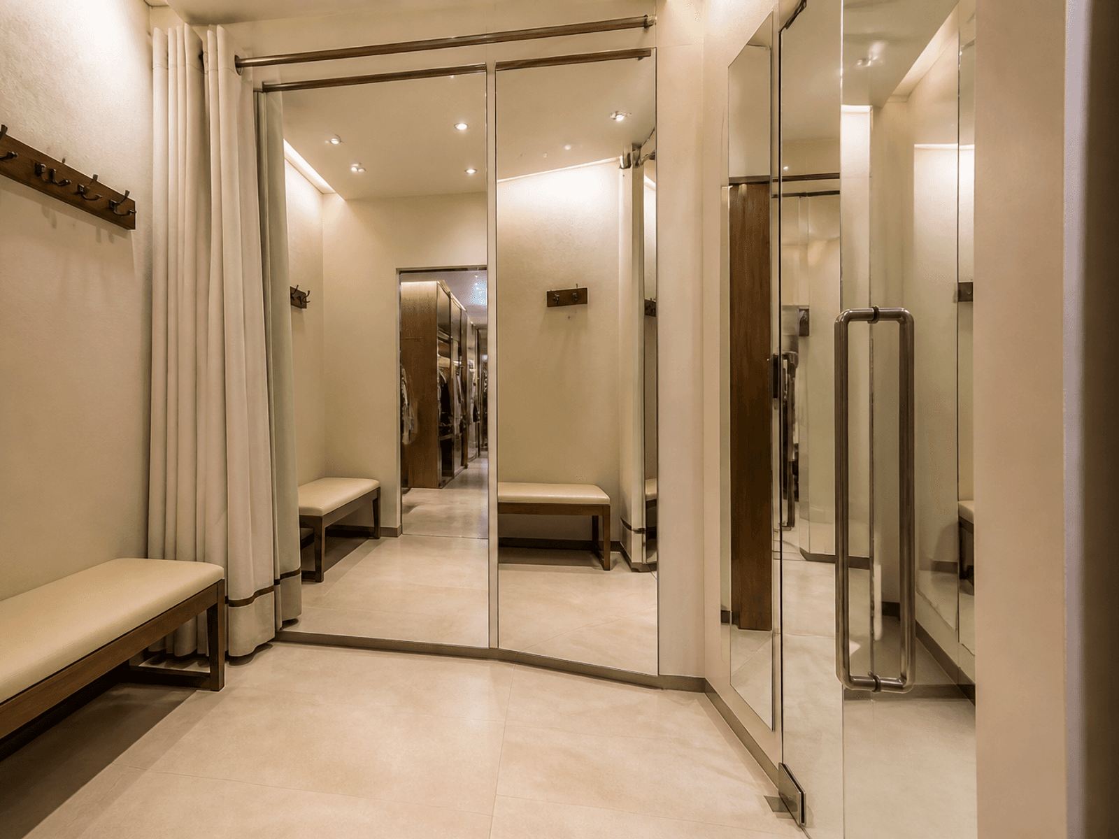 Retail trial room with mirrors and glass