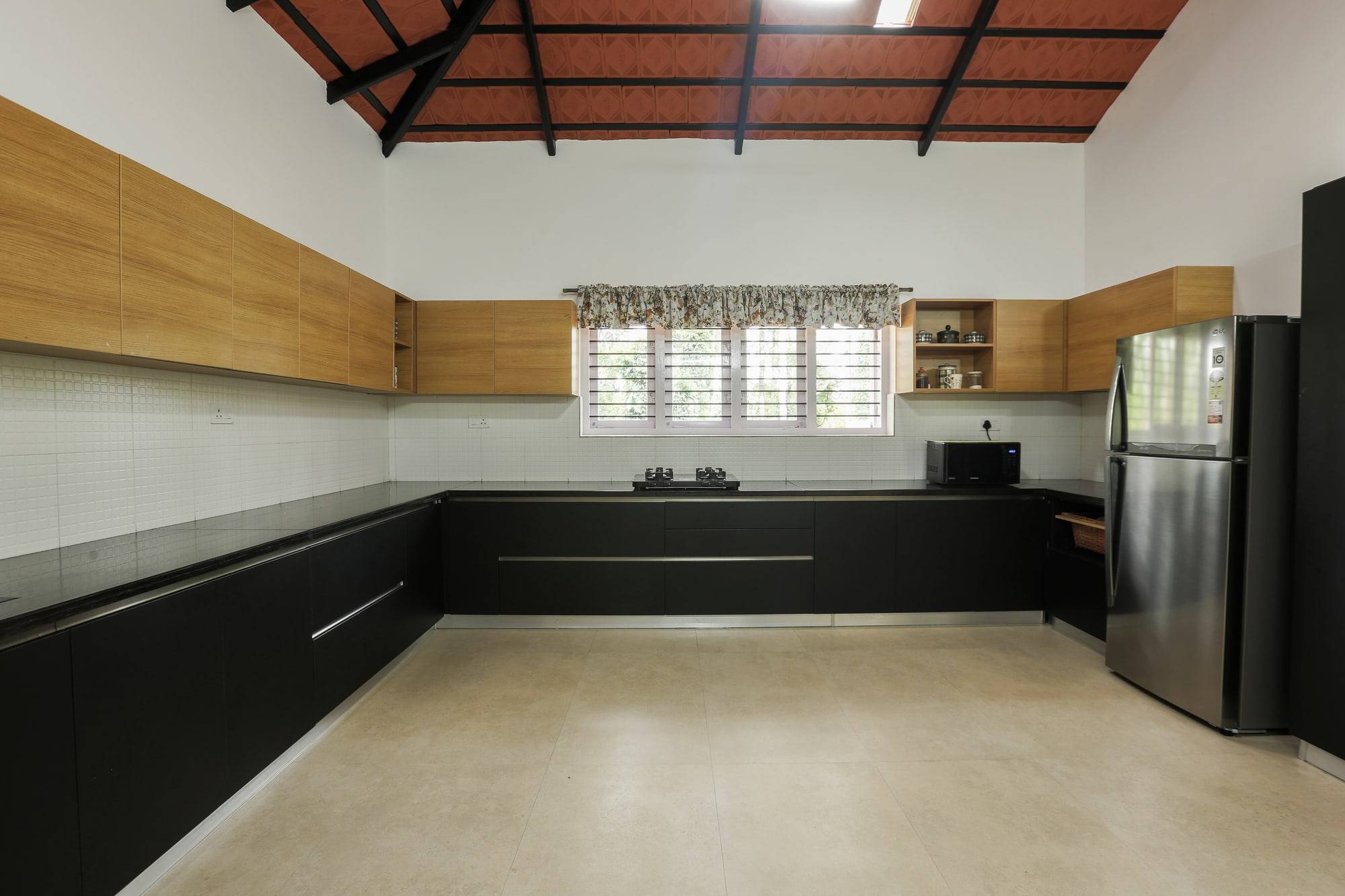 Matte black and natural oak modular kitchen under pitched roof