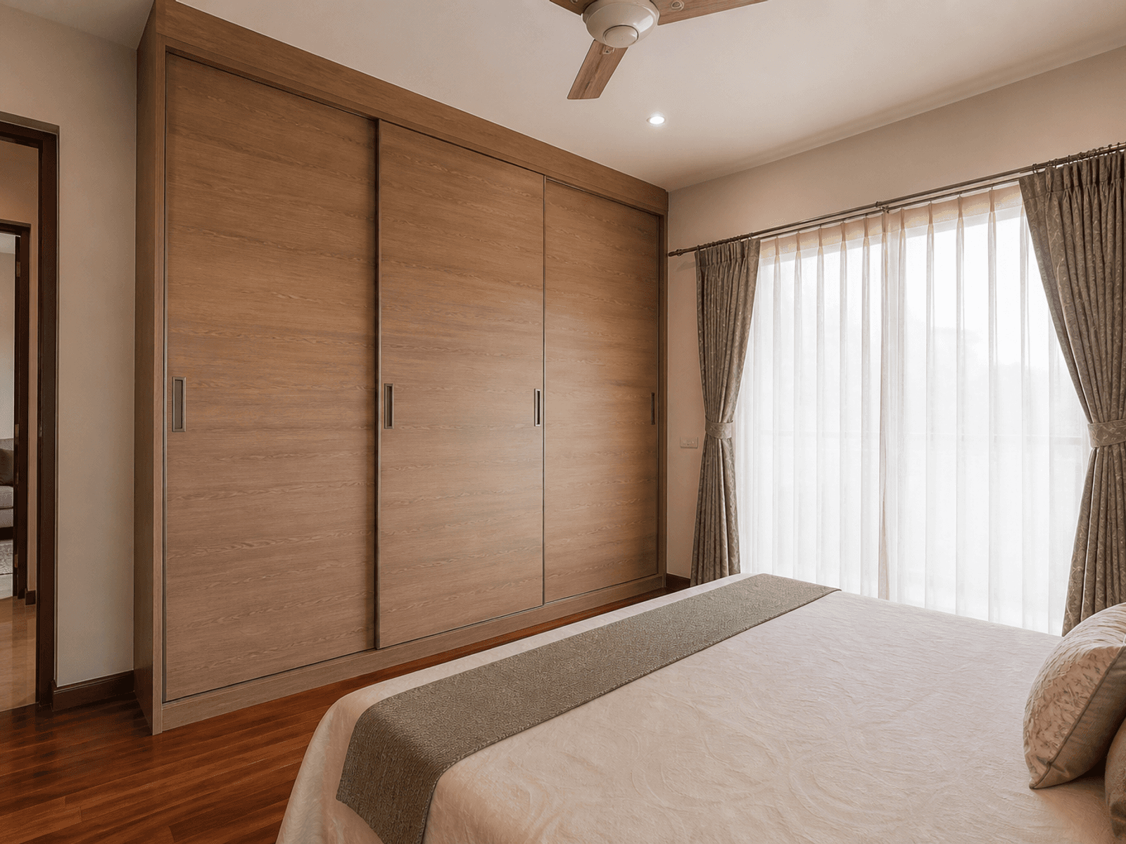Laminate sliding wardrobe in a bedroom